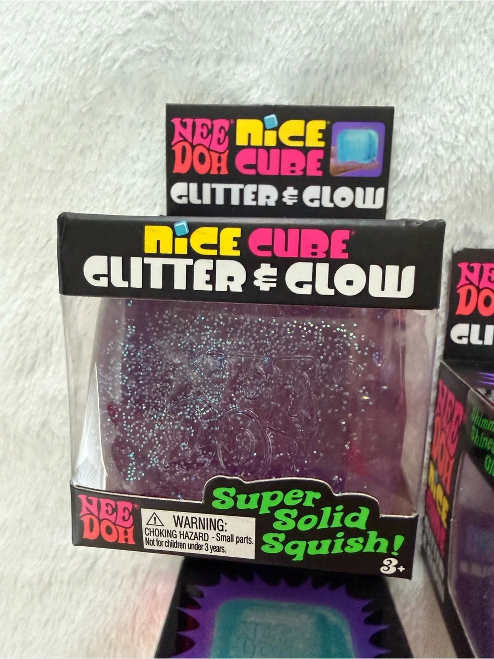 Set of Needoh Nice Cube Glitter & Glow Squishy Toys - Purple and Blue